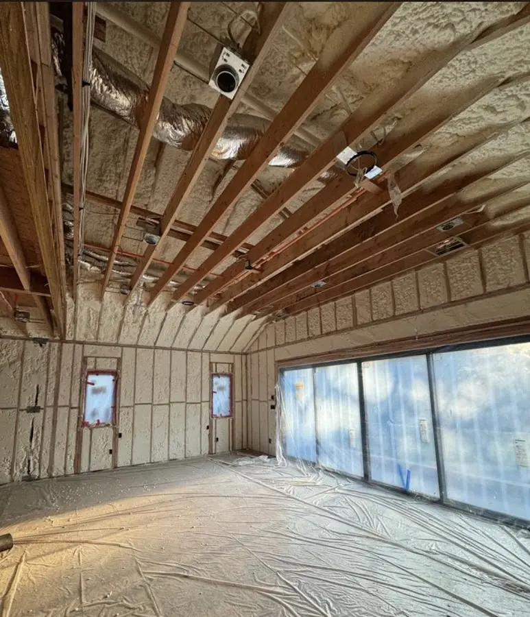 Interior walls and ceiling insulated with spray foam during new construction in South Valley